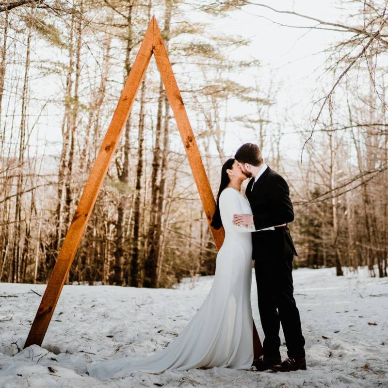 Couple kissing after winter elopement ceremony in Vermont