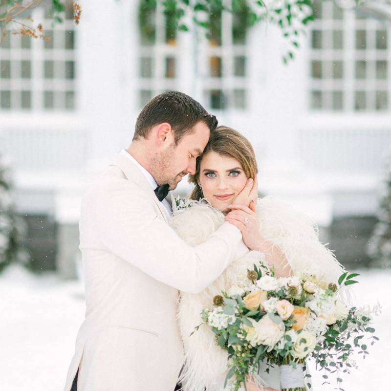 Couple embracing during winter elopement styled shoot at Inn at Burkyn in Vermont