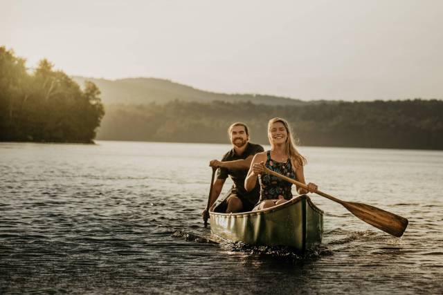 adventurous engagement session with couples in a canoe