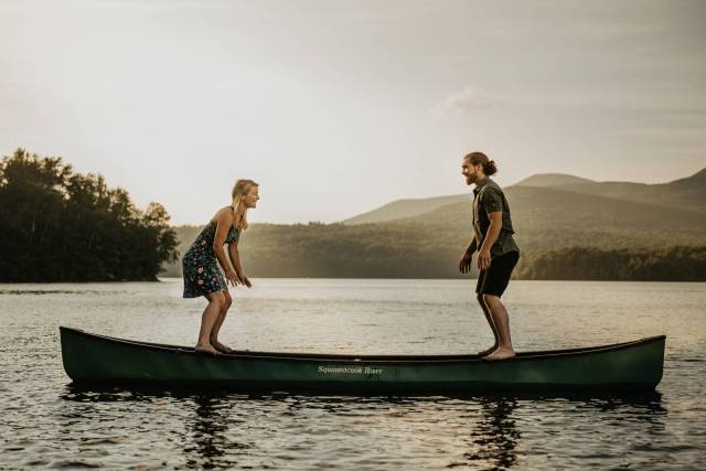 adventurous engagement session on a lake in a canoe