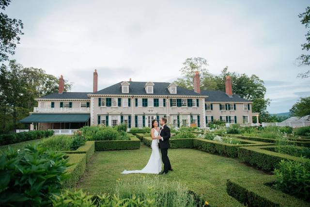 Bride and groom on the lawn at VT historic estate