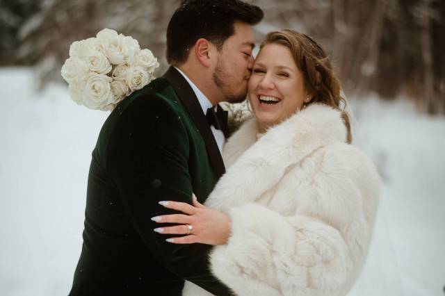 Couple smiling on winter wedding day at Sleepy Hollow Inn in Vermont